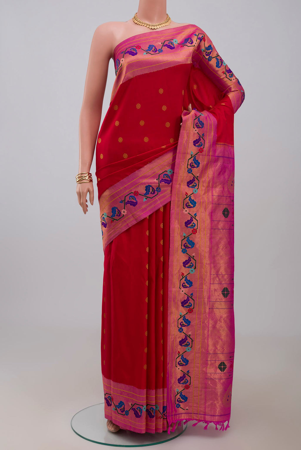 Red Gadwal Silk Saree with Zari Butta on the body and Paithani Border.  displayed on a mannequin