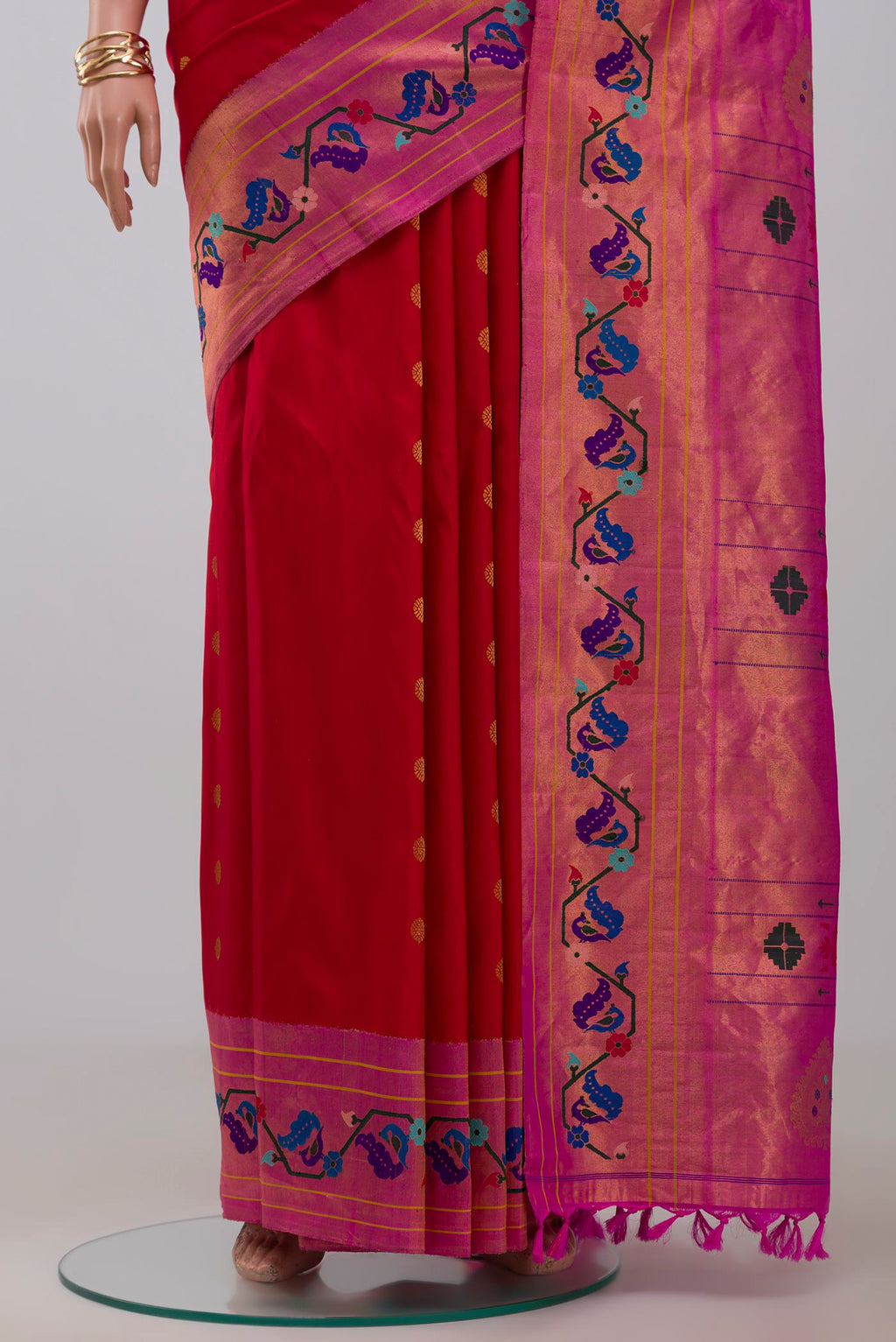 Pleats and pallu of Red Gadwal Silk Saree with Zari Butta on the body and Paithani Border. 