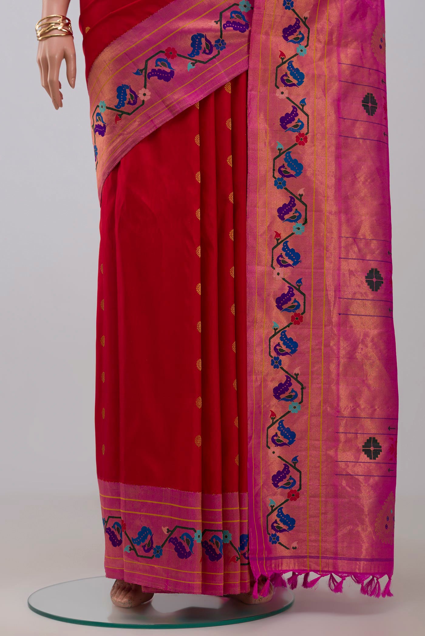 Pleats and pallu of Red Gadwal Silk Saree with Zari Butta on the body and Paithani Border. 