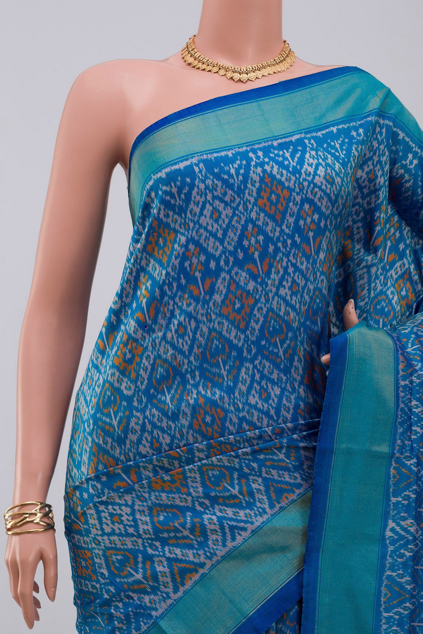 Border image of Blue Pochampally Silk Saree with Ikat design on the body and Zari Border. 