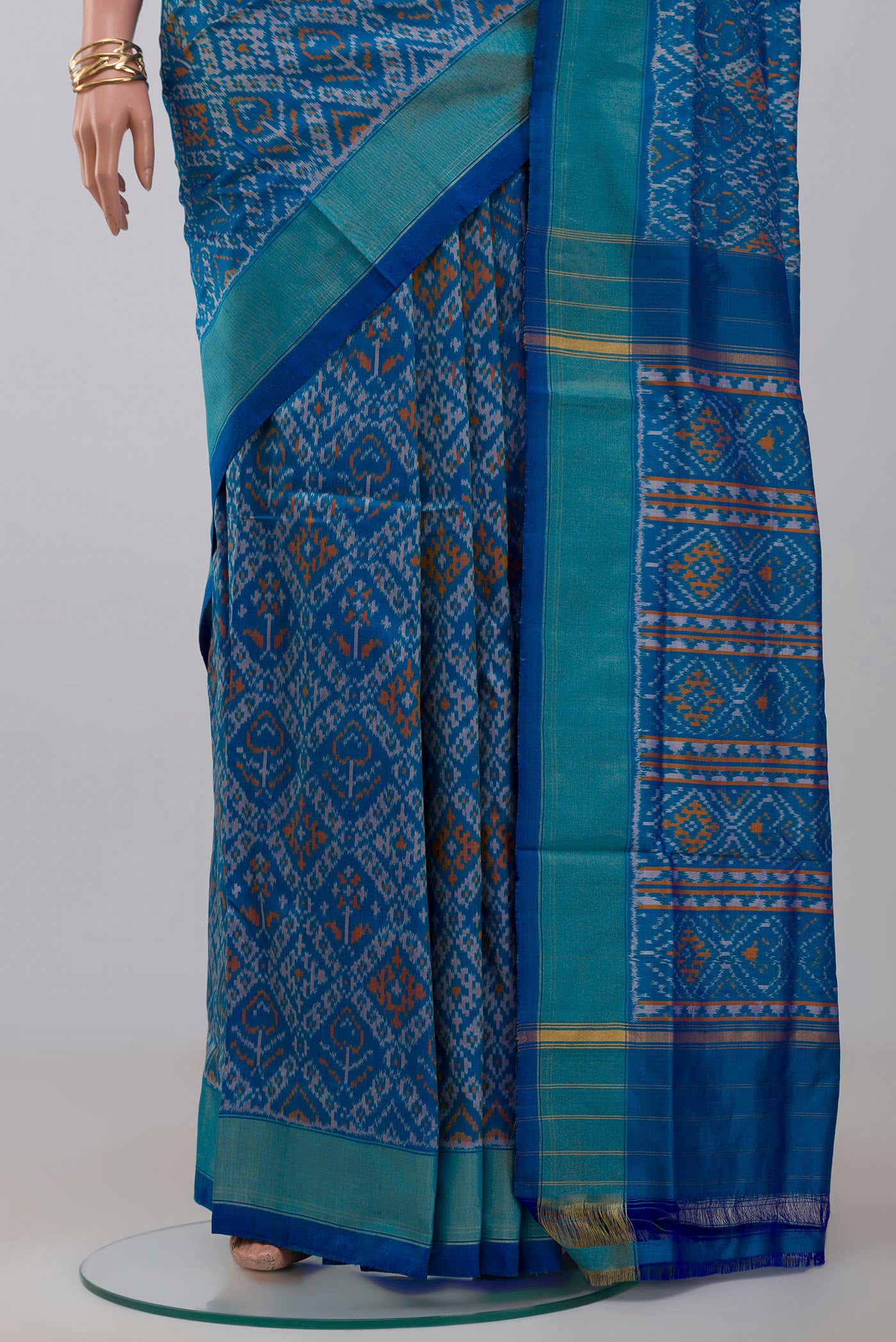 Pleats and pallu of Blue Pochampally Silk Saree with Ikat design on the body and Zari Border. 