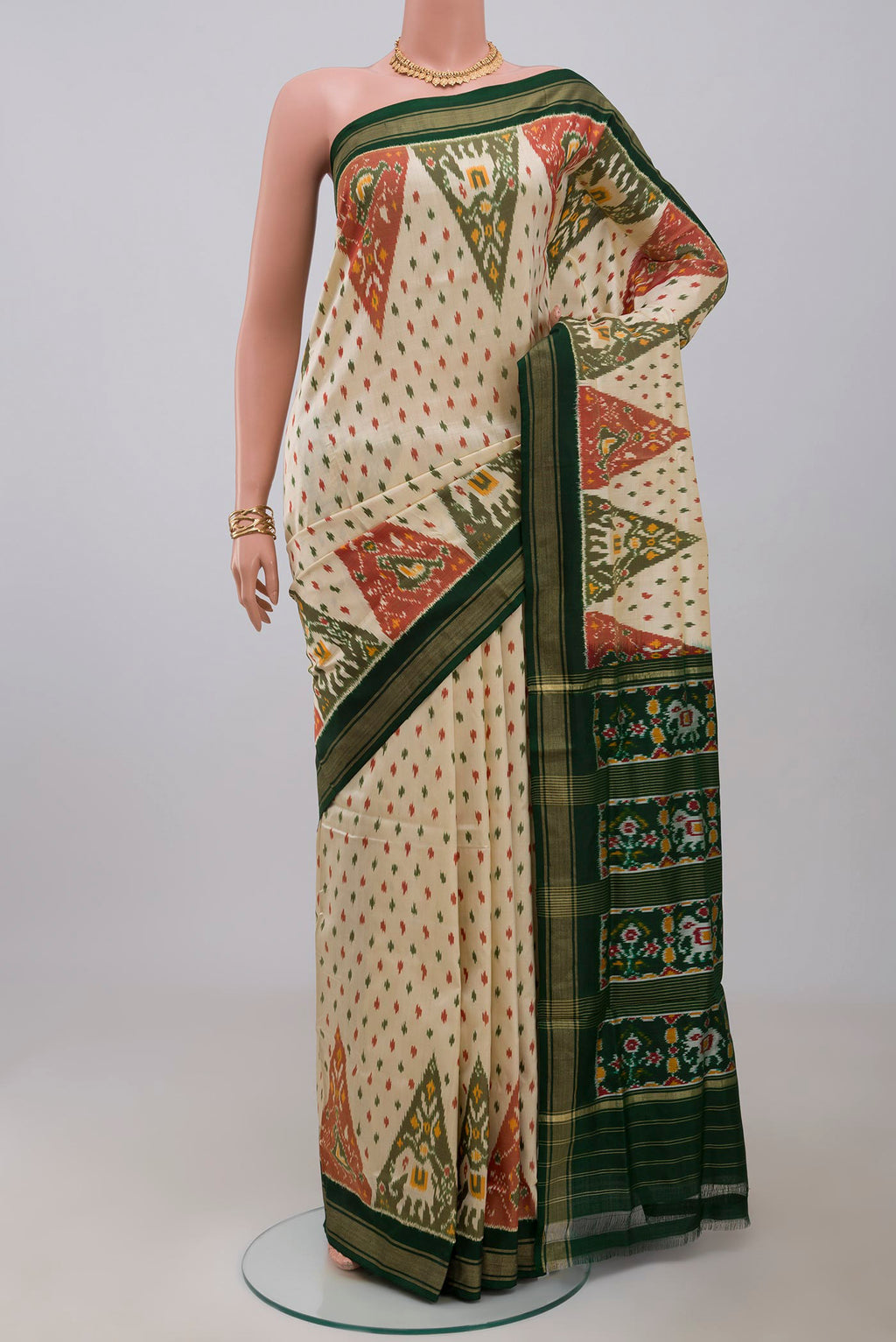 Cream Pochampally Saree with Ikat Print on the body and Thin Zari Line.  displayed on a mannequin
