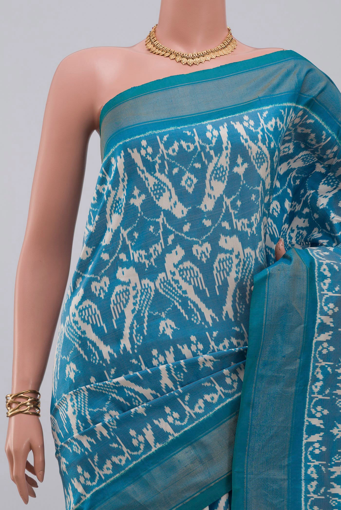 Border image of Sky Blue Pochampally Saree with Ikat design on the body and Zari Border. 