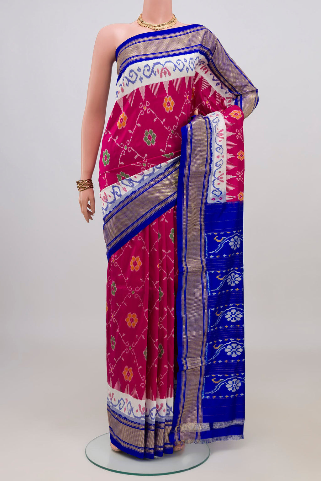 Pink Pochampally Silk Saree with Ikat design on the body and Zari Border.  displayed on a mannequin