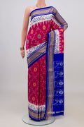 Pink Pochampally Silk Saree with Ikat design on the body and Zari Border.  displayed on a mannequin