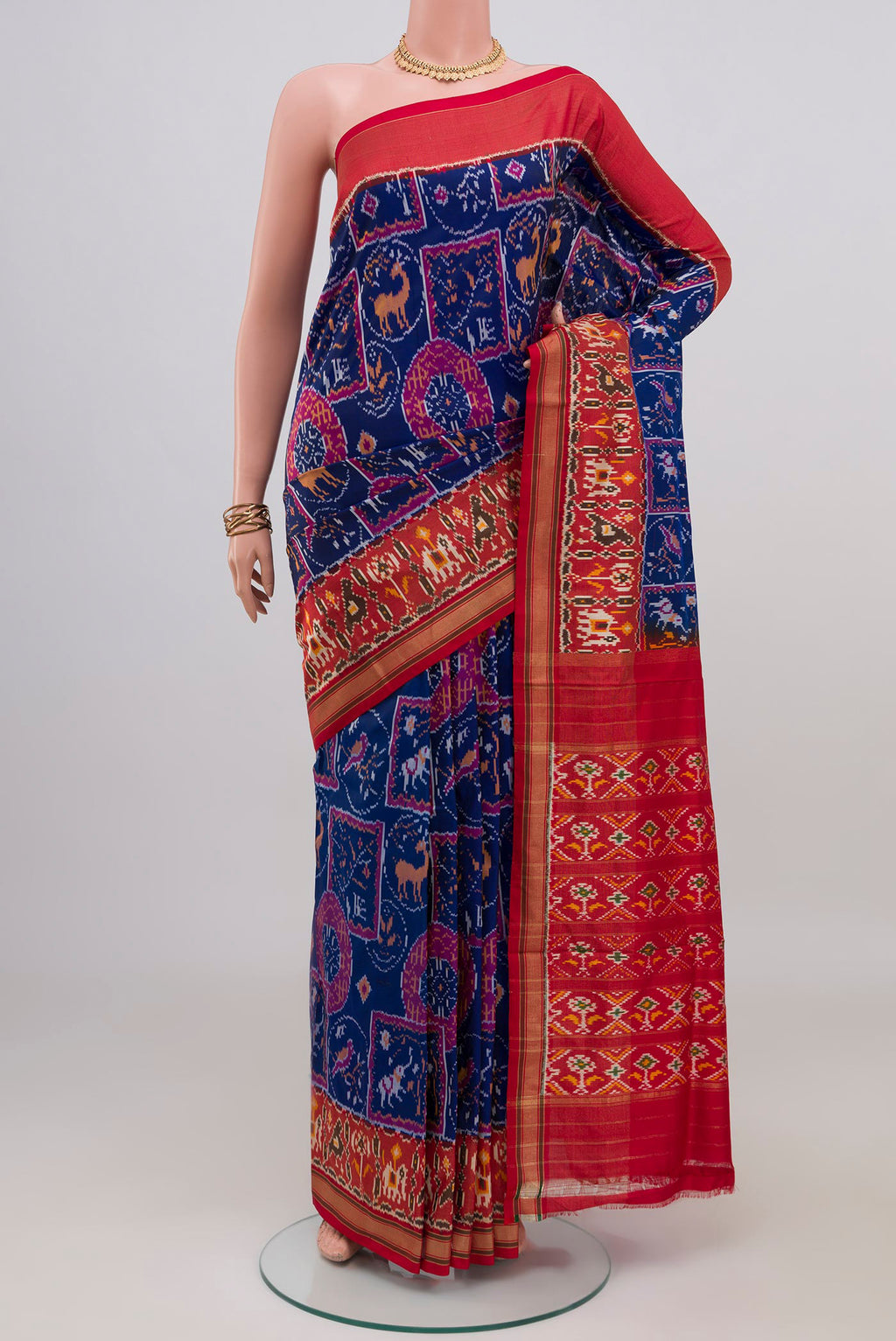 Blue Pochampally Silk Saree with Ikat design on the body and Zari Border.  displayed on a mannequin