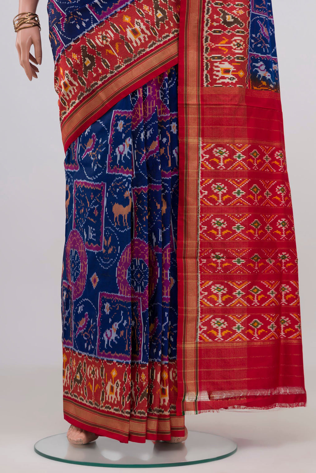 Pleats and pallu of Blue Pochampally Silk Saree with Ikat design on the body and Zari Border. 