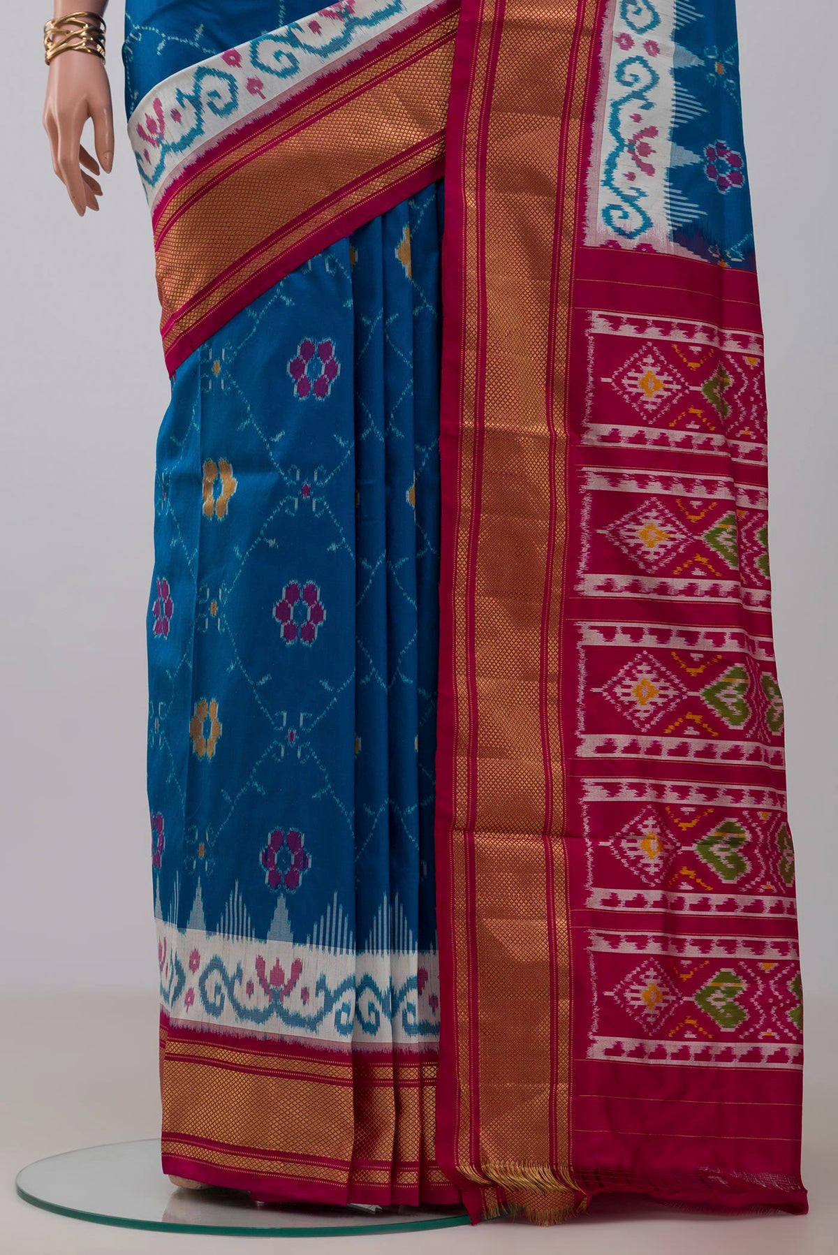 Pleats and pallu of Blue Pochampally Silk Saree with Ikat design on the body and Zari Border. 