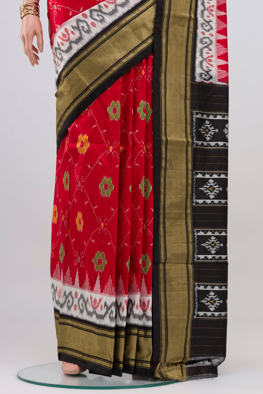 Pleats and pallu of Red Pochampally Silk Saree with Ikat design on the body and Zari Border. 