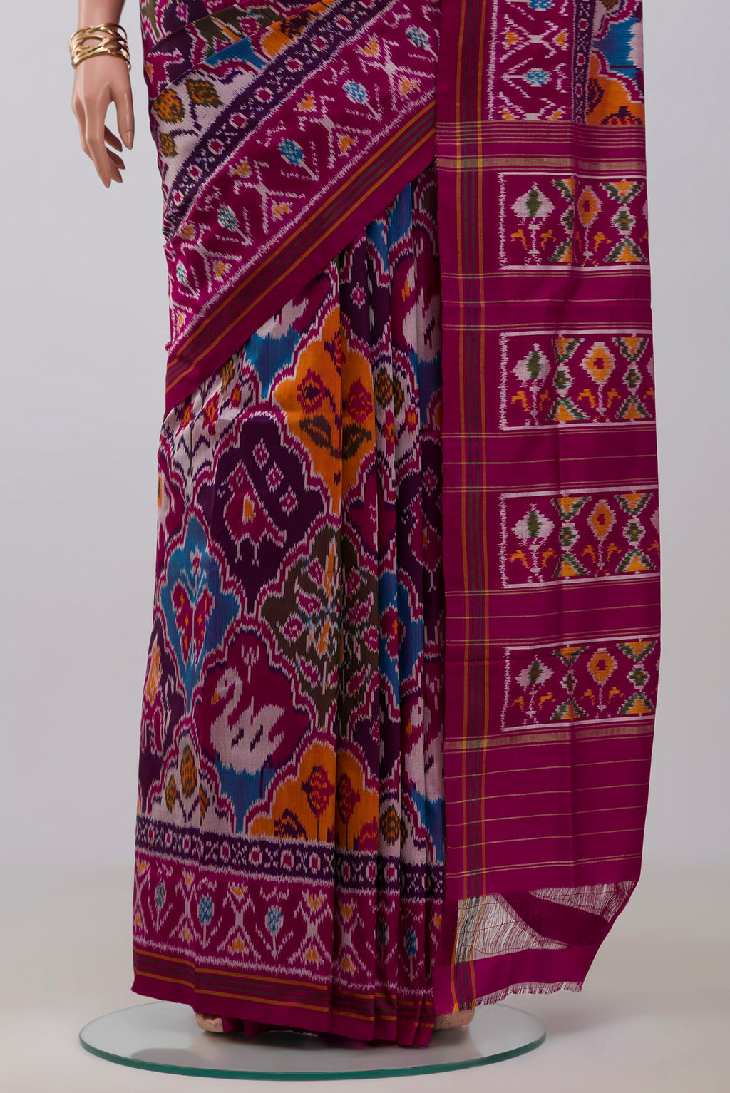 Pleats and pallu of Purple Pochampally Saree with Ikat Print on the body and Ikat Border. 