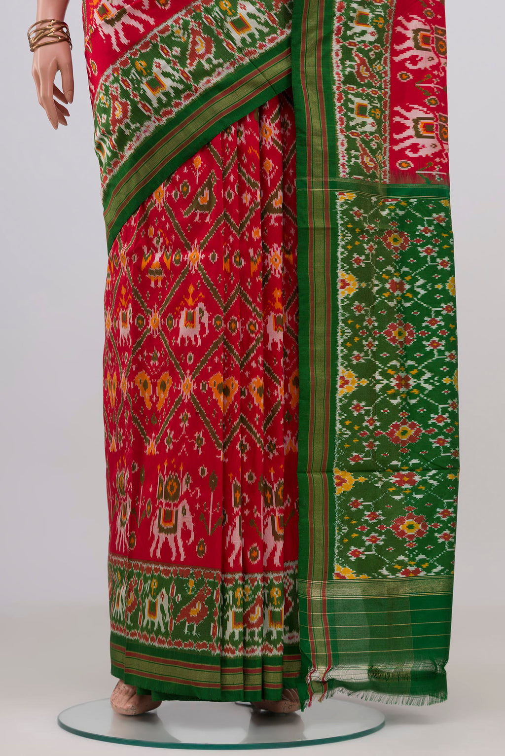 Pleats and pallu of Red Pochampally Silk Saree with Ikat design on the body and Zari Border. 