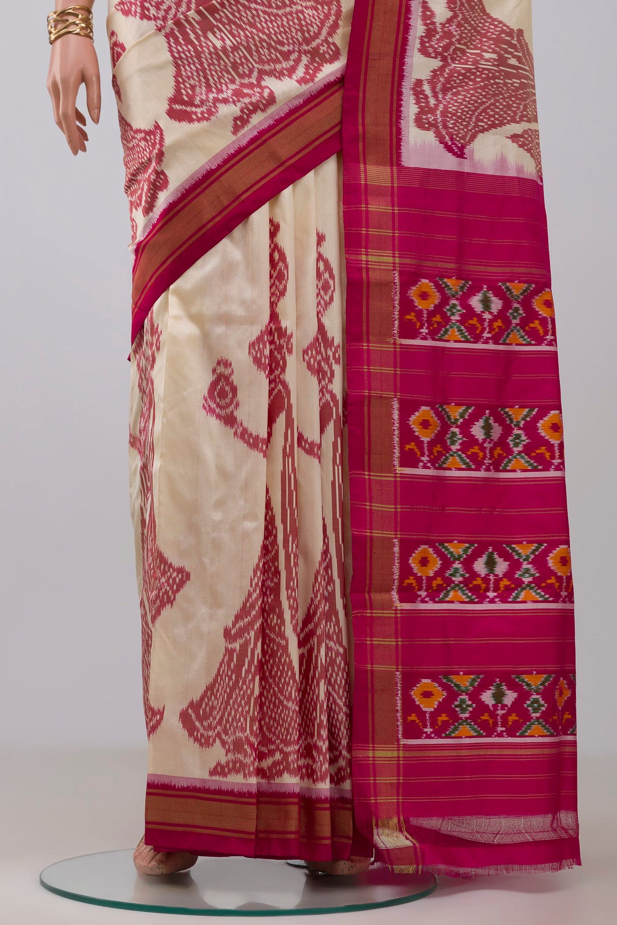Pleats and pallu of Off White Pochampally Silk Saree with Ikat design on the body and Zari Border. 