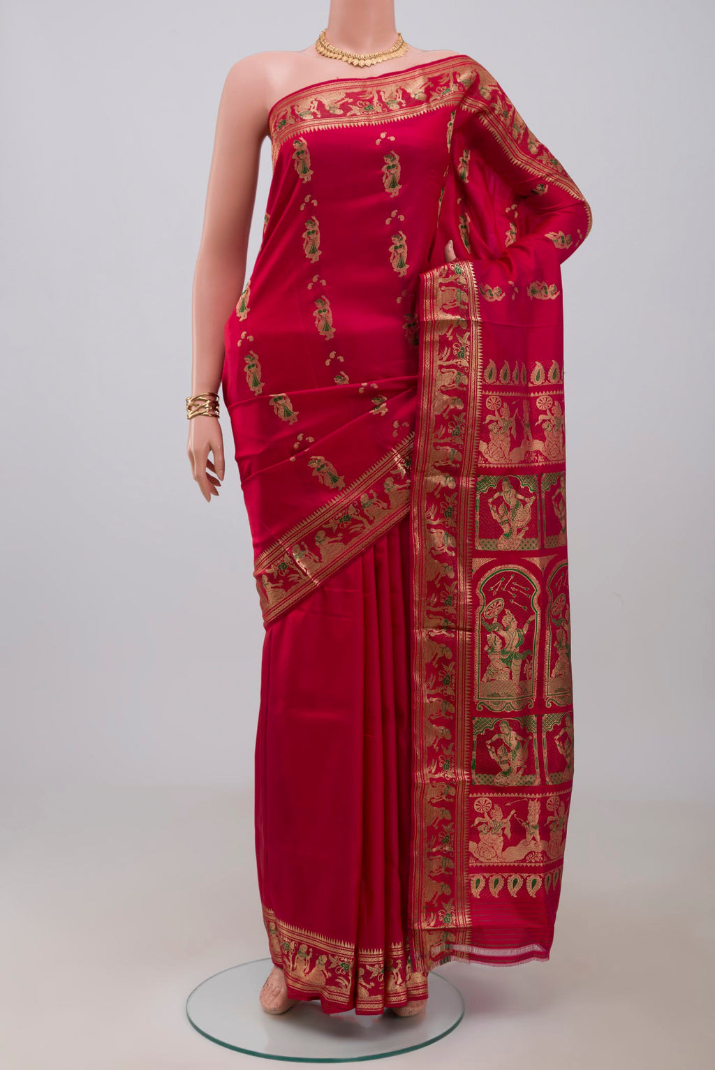 Red Baluchari Silk Saree with Zari And Thread Butta on the body and Zari Border.  displayed on a mannequin