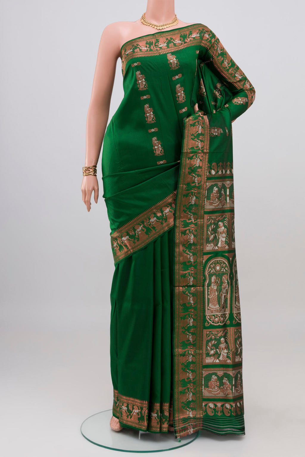 Green Baluchari Silk Saree with Zari And Thread Butta on the body and Zari Border.  displayed on a mannequin