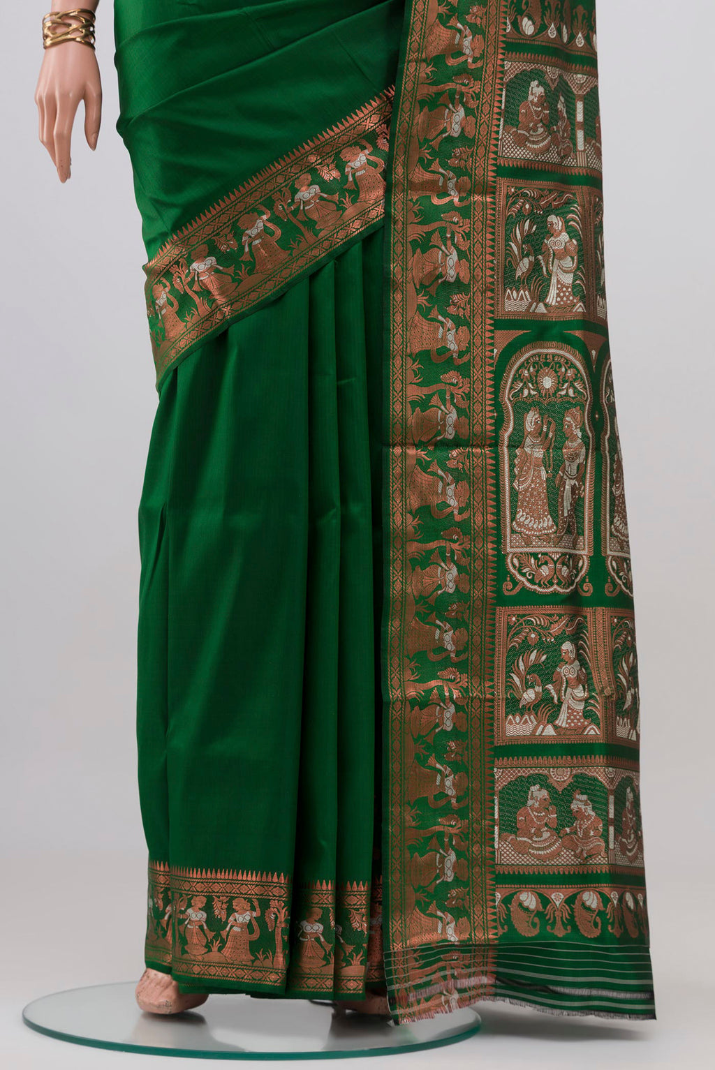 Pleats and pallu of Green Baluchari Silk Saree with Zari And Thread Butta on the body and Zari Border. 