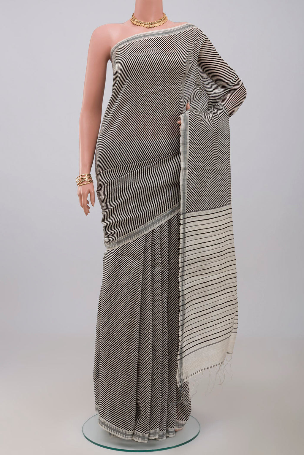 Cream Jute Silk Saree with Fancy on the body and Plain Border.  displayed on a mannequin