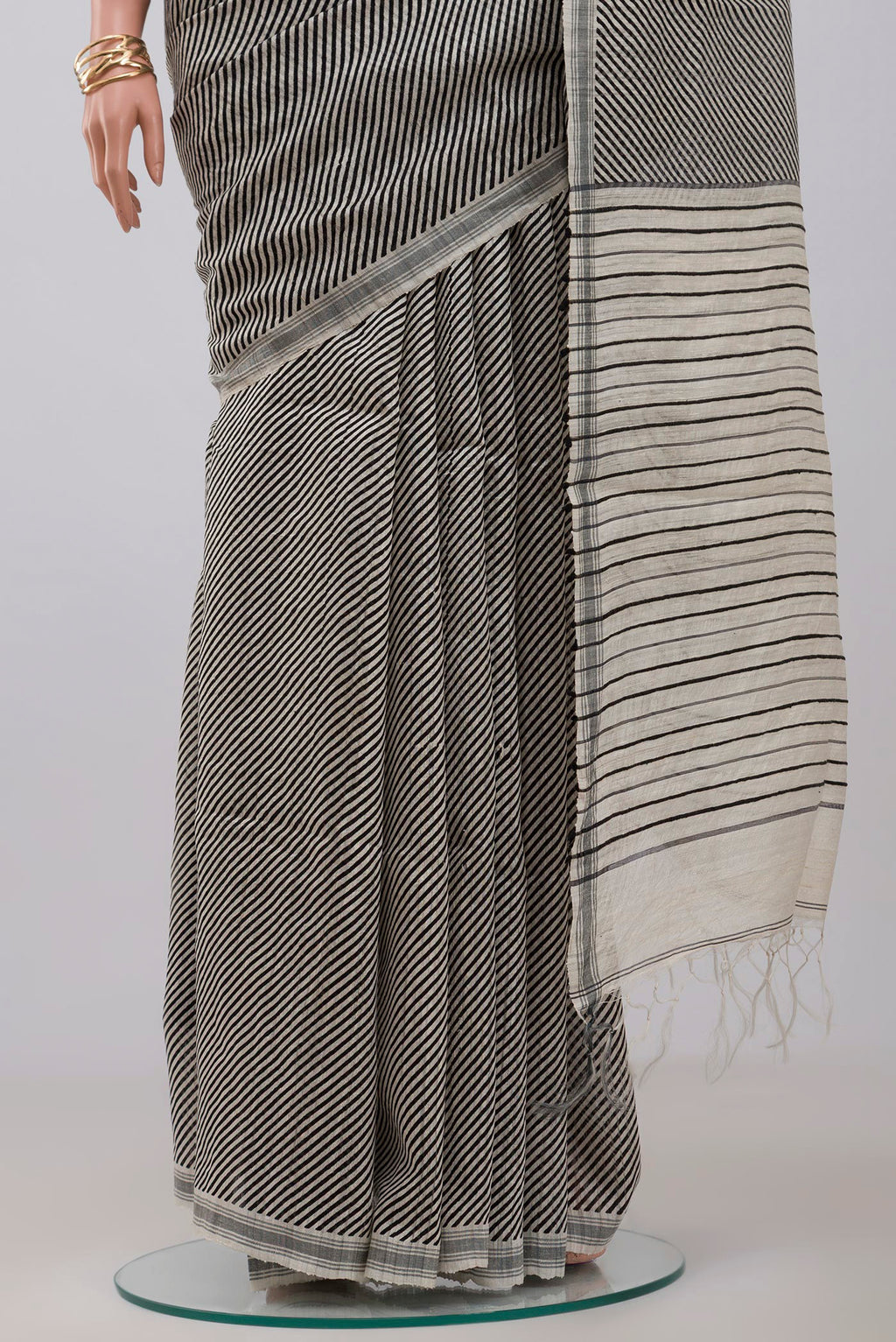 Pleats and pallu of Cream Jute Silk Saree with Fancy on the body and Plain Border. 