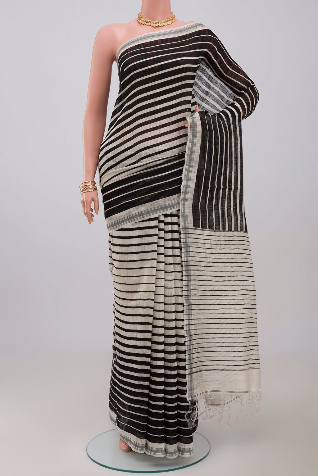 Cream Jute Silk Saree with Fancy on the body and Plain Border.  displayed on a mannequin