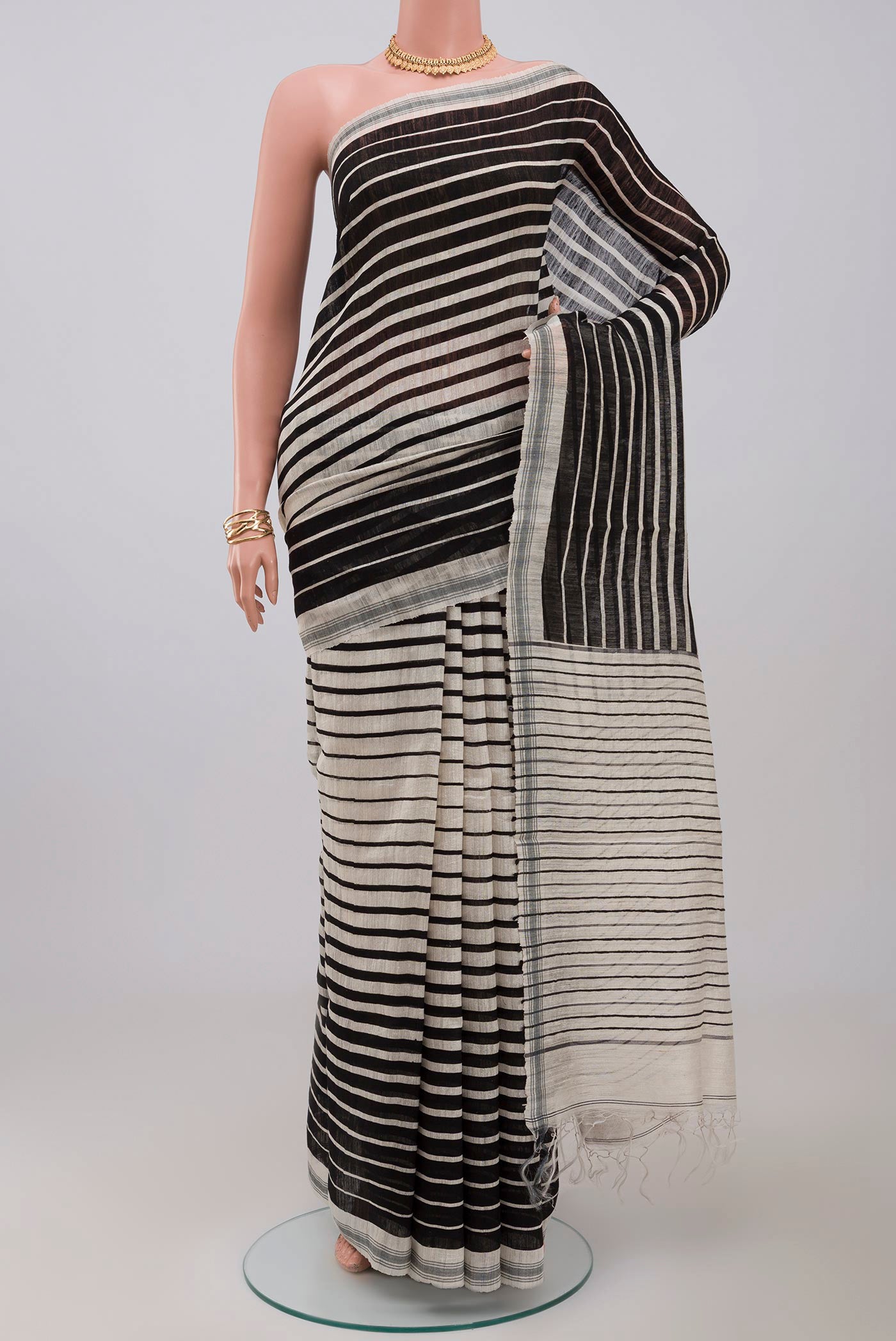 Cream Jute Silk Saree with Fancy on the body and Plain Border.  displayed on a mannequin