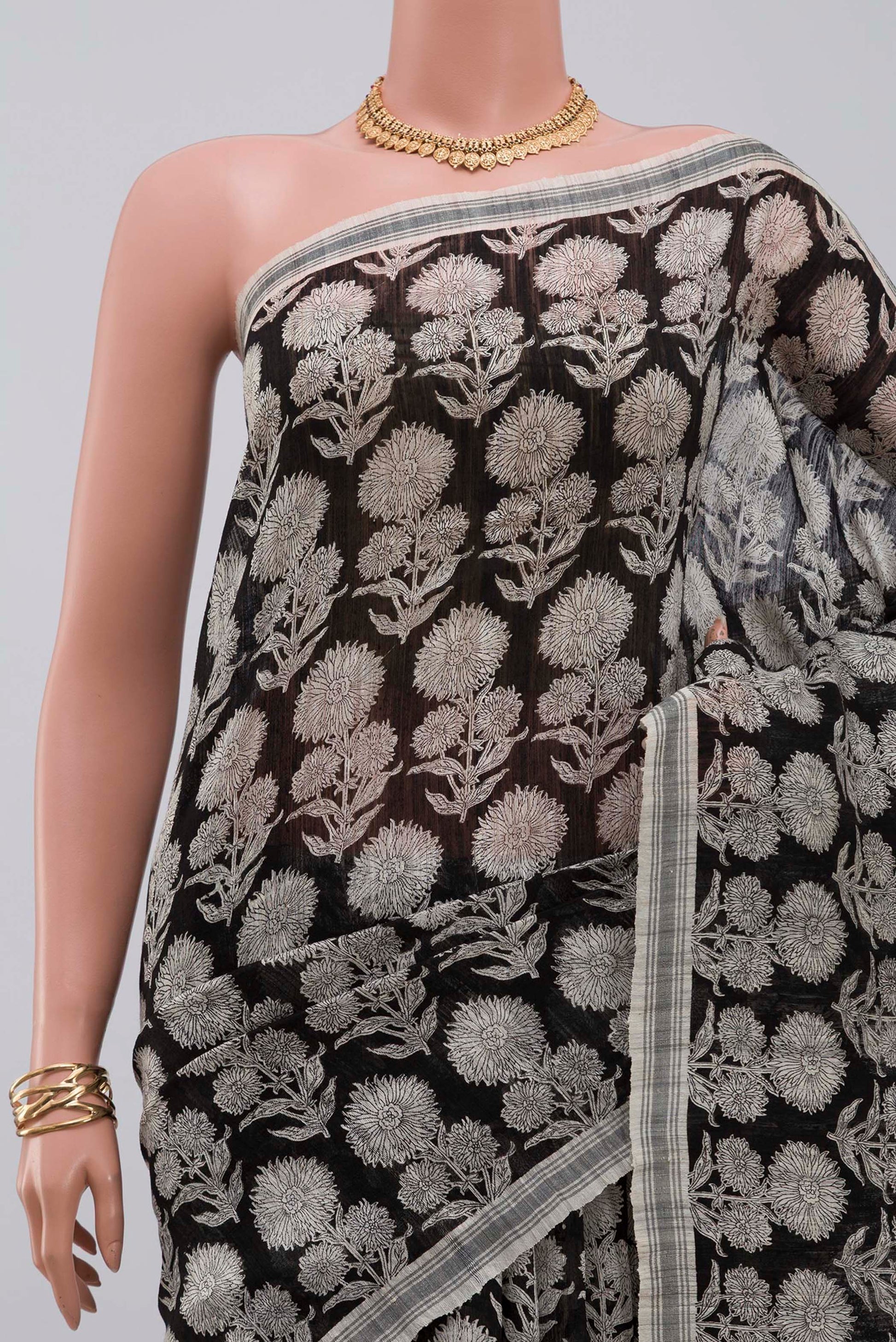 Border image of Black Tussar Silk Saree with Printed design on the body and Plain Border. 