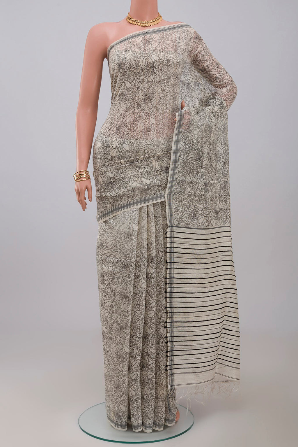 Cream Jute Silk Saree with Fancy on the body and Plain Border.  displayed on a mannequin