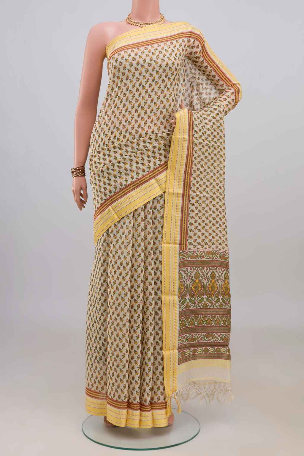 Beige Tussar Saree with Printed design on the body and Thread Border.  displayed on a mannequin