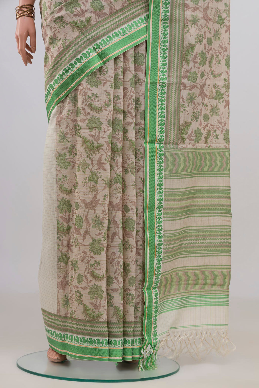 Pleats and pallu of Beige Tussar Saree with Floral Print on the body and Thread Border. 