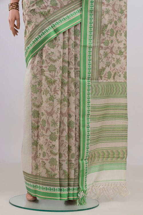 Pleats and pallu of Beige Tussar Saree with Floral Print on the body and Thread Border. 