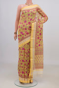 Yellow Tussar Saree with Floral Print on the body and Thread Border.  displayed on a mannequin
