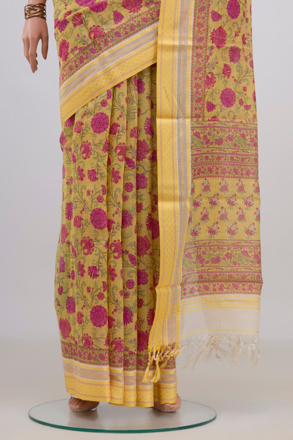 Pleats and pallu of Yellow Tussar Saree with Floral Print on the body and Thread Border. 