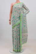 Beige Tussar Saree with Floral Print on the body and Thread Border.  displayed on a mannequin