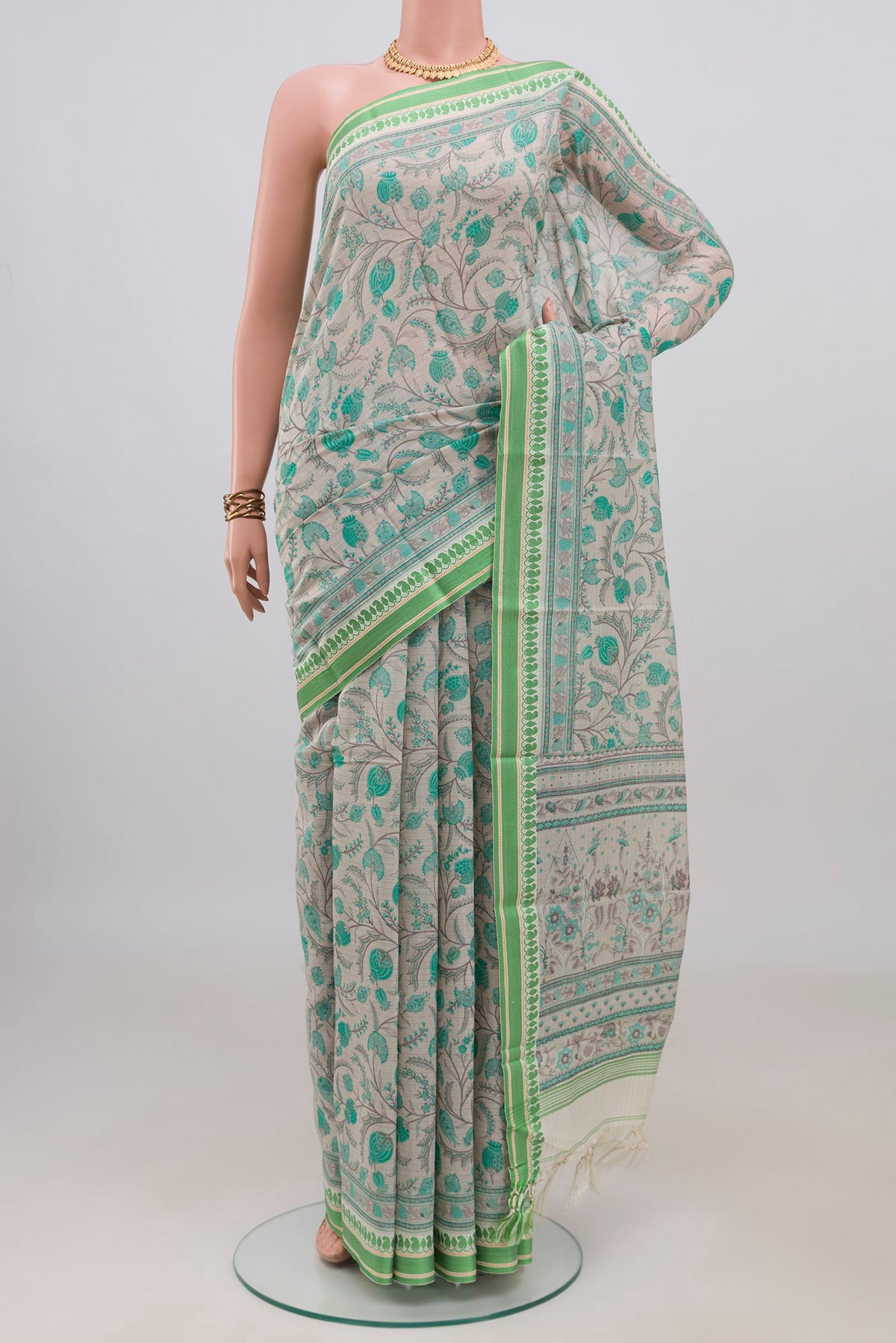 Beige Tussar Saree with Floral Print on the body and Thread Border.  displayed on a mannequin