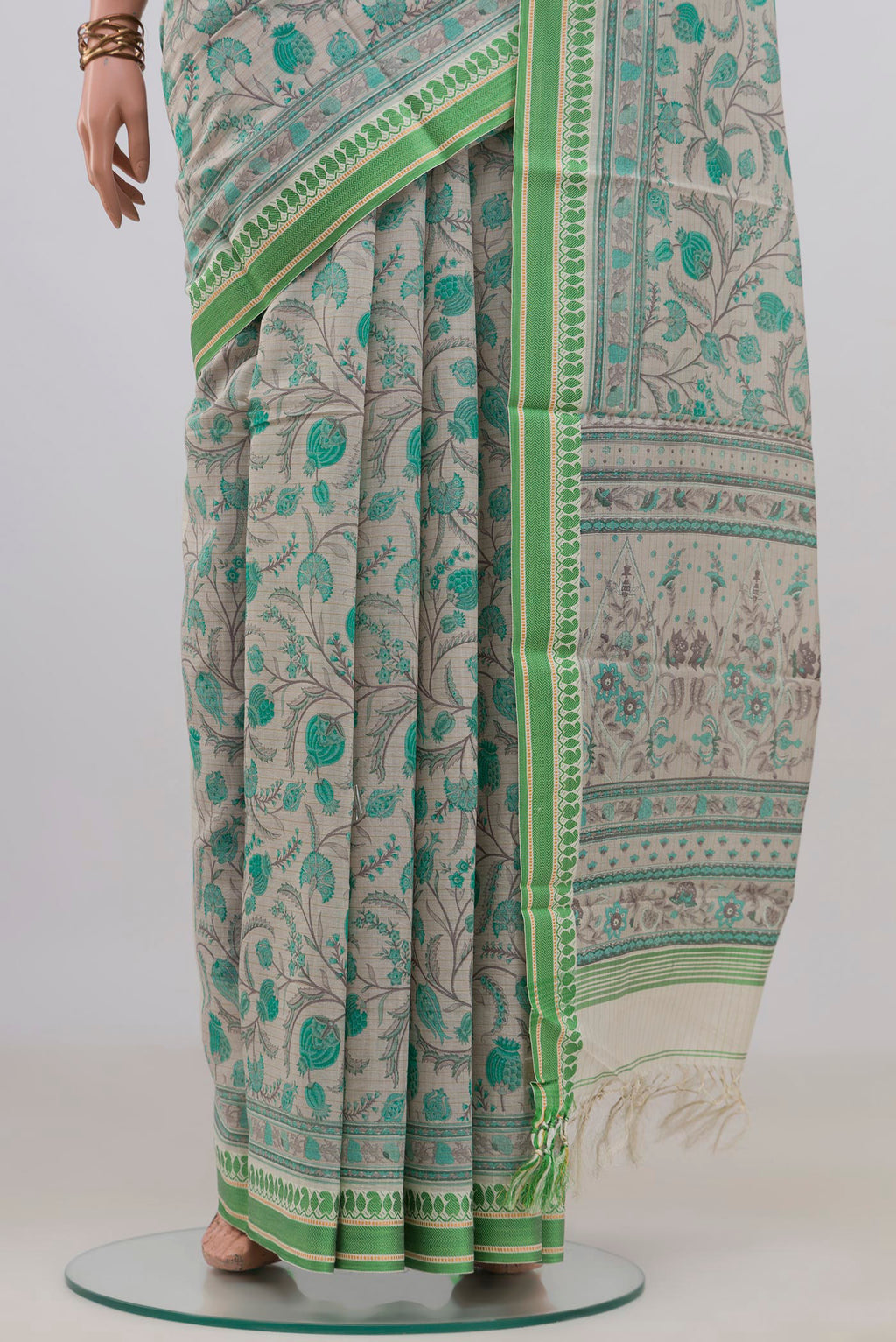 Pleats and pallu of Beige Tussar Saree with Floral Print on the body and Thread Border. 