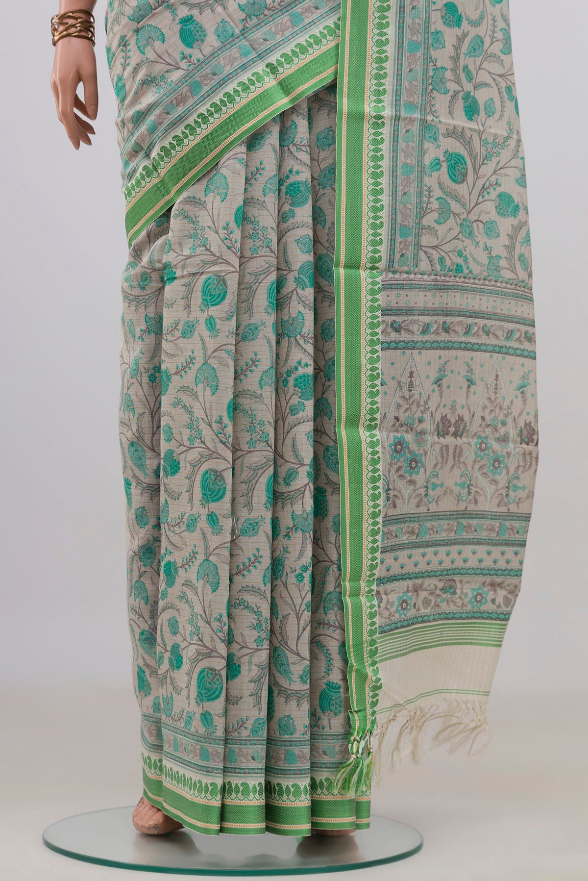 Pleats and pallu of Beige Tussar Saree with Floral Print on the body and Thread Border. 