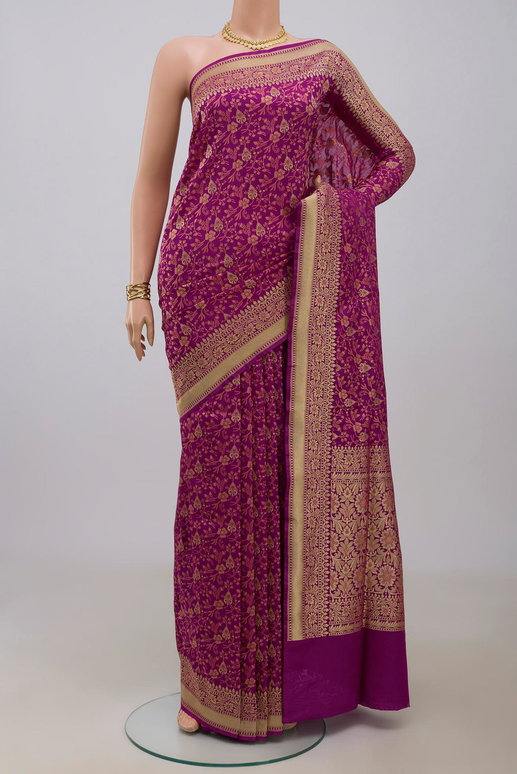 Magenta Banarasi Saree with Fancy on the body and Fancy Border.  displayed on a mannequin