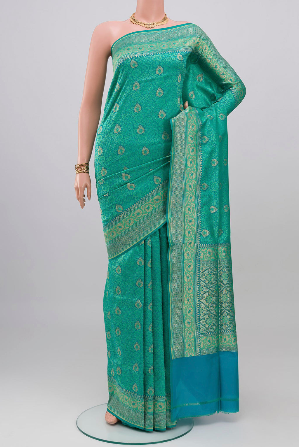 Turquoise Banarasi Silk Saree with Jacquard With Zari Butta on the body and Zari Border.  displayed on a mannequin