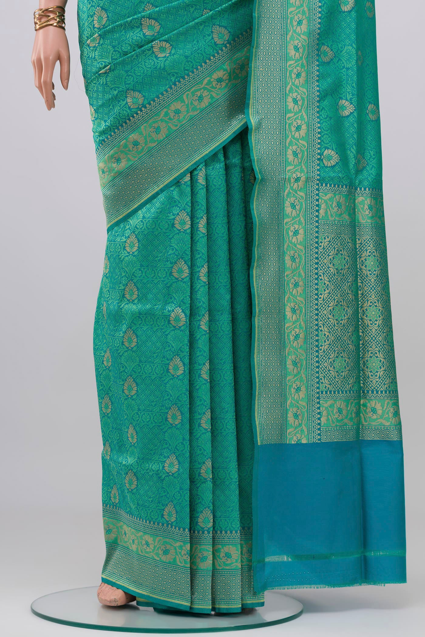 Pleats and pallu of Turquoise Banarasi Silk Saree with Jacquard With Zari Butta on the body and Zari Border. 