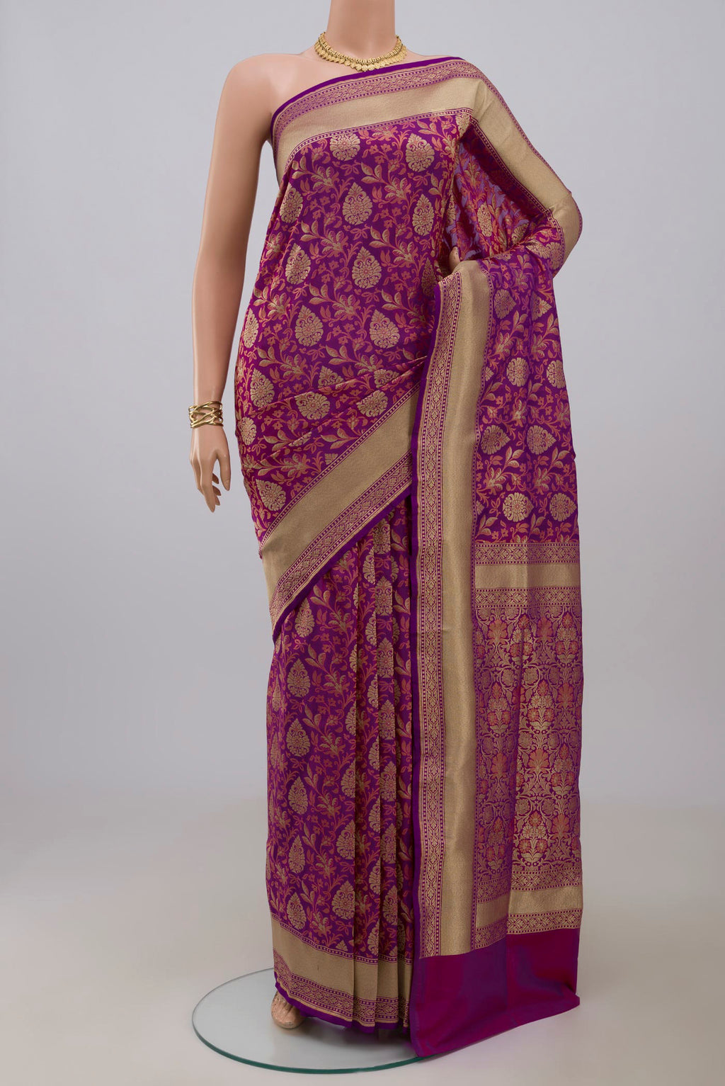Purple Banarasi Saree with Fancy on the body and Fancy Border.  displayed on a mannequin