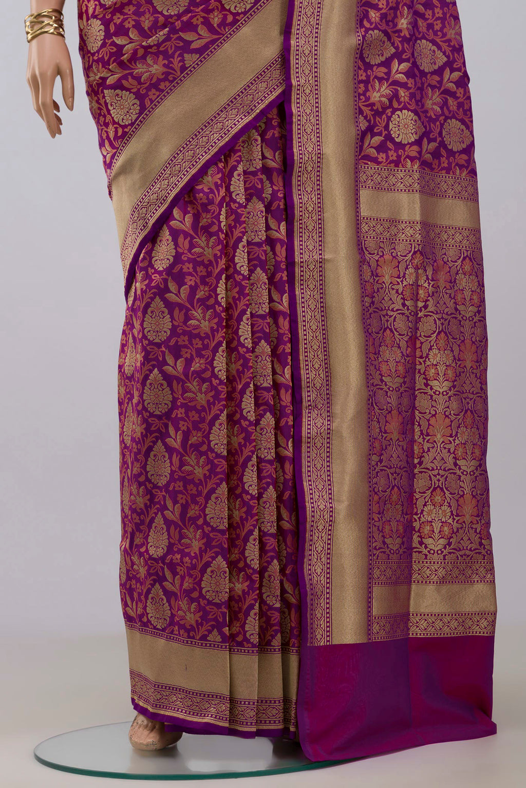 Pleats and pallu of Purple Banarasi Saree with Fancy on the body and Fancy Border. 