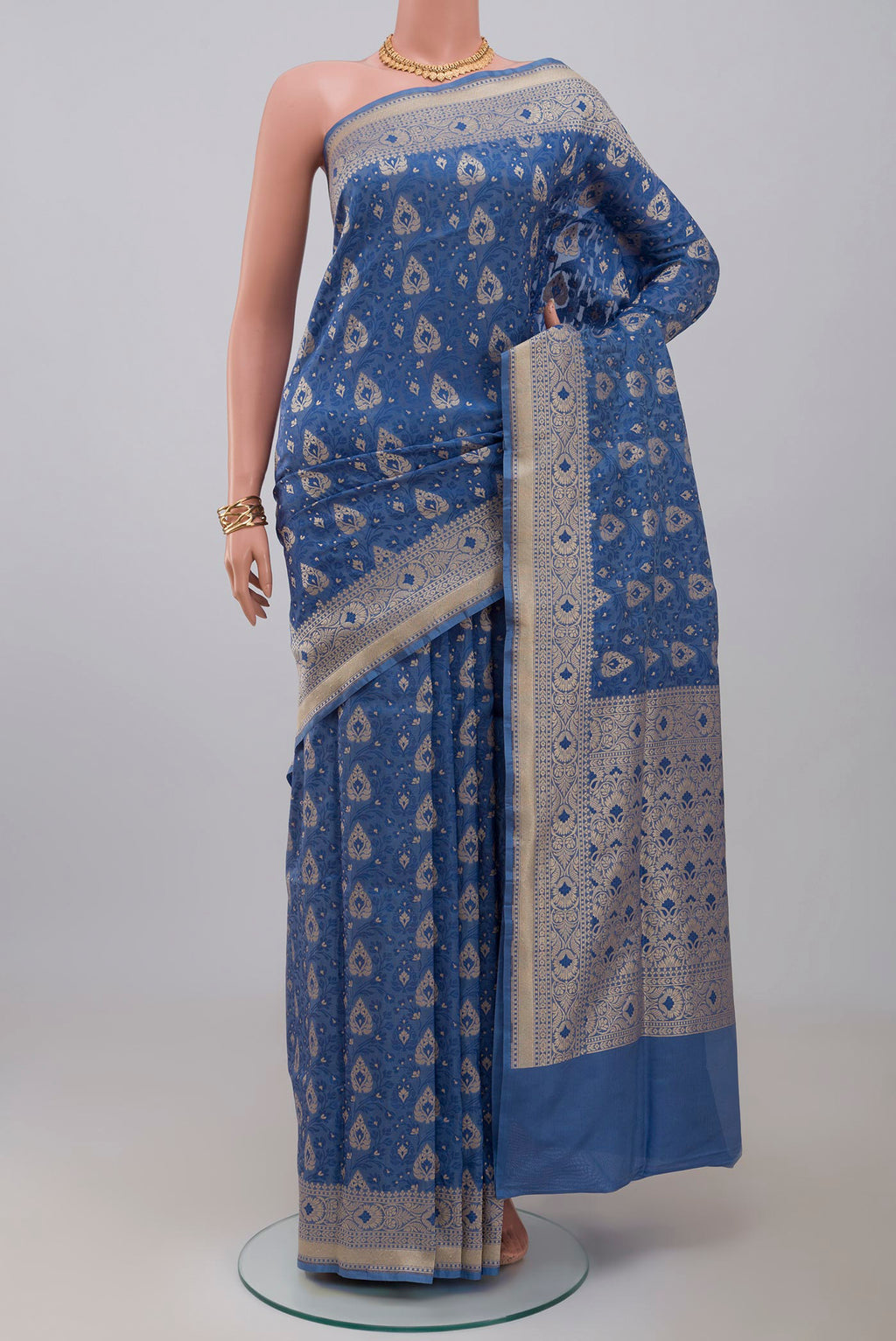 Blue Banarasi Saree with Fancy on the body and Fancy Border.  displayed on a mannequin