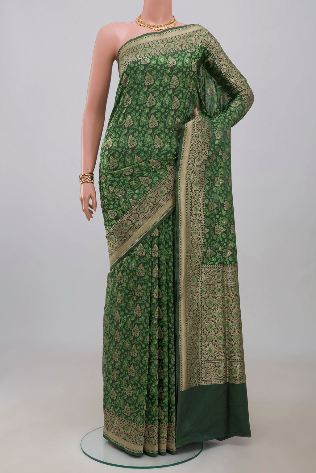 Green Banarasi Saree with Fancy on the body and Fancy Border.  displayed on a mannequin