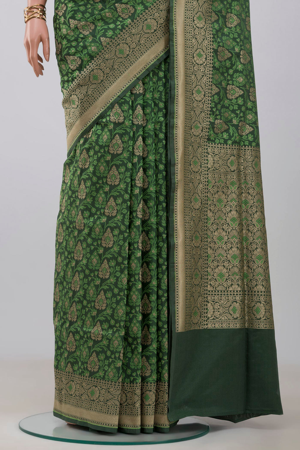 Pleats and pallu of Green Banarasi Saree with Fancy on the body and Fancy Border. 