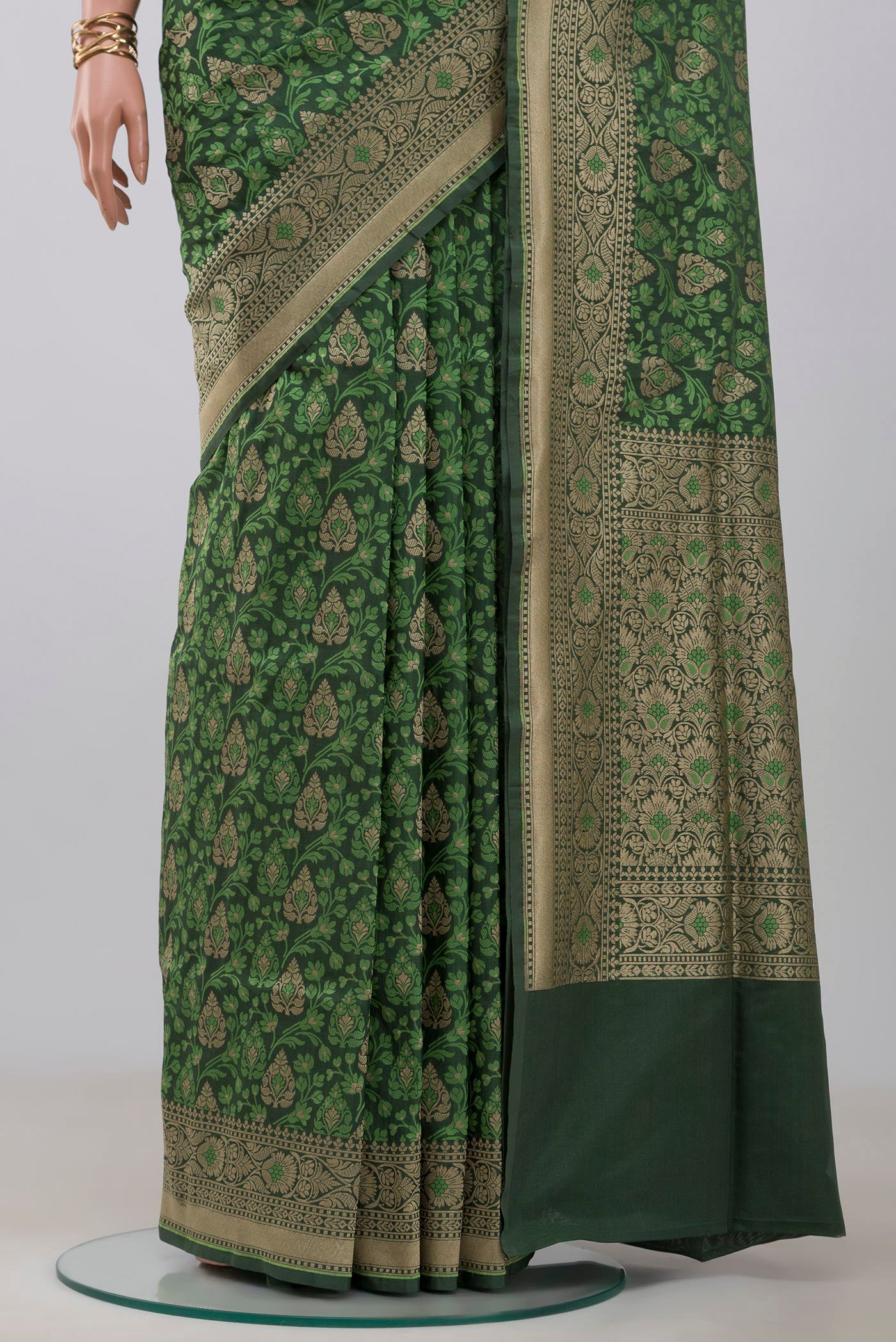 Pleats and pallu of Green Banarasi Saree with Fancy on the body and Fancy Border. 