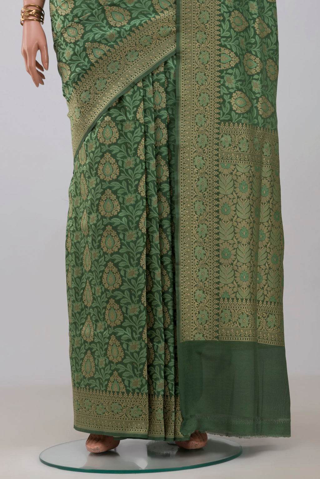 Pleats and pallu of Green Banarasi Silk Saree with Jacquard With Zari Butta on the body and Fancy Border. 