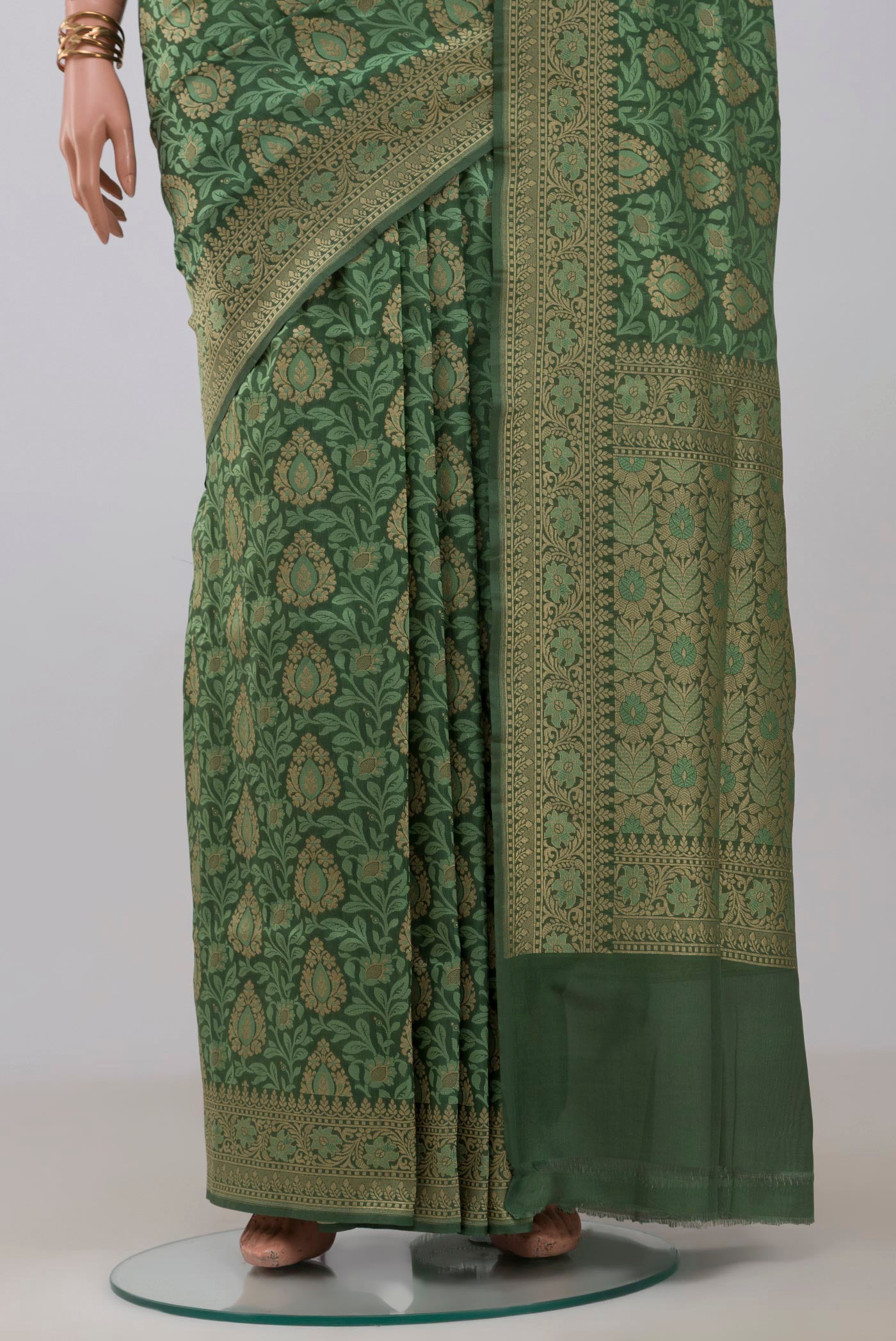 Pleats and pallu of Green Banarasi Silk Saree with Jacquard With Zari Butta on the body and Fancy Border. 