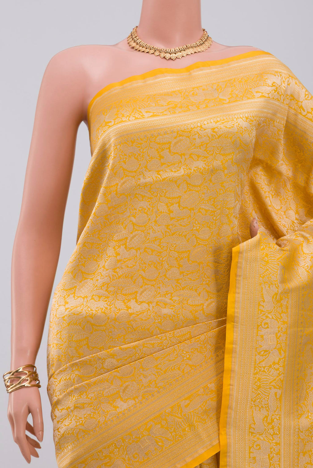 Border image of Yellow Banarasi Saree with Zari Brocade on the body and Fancy Border. 