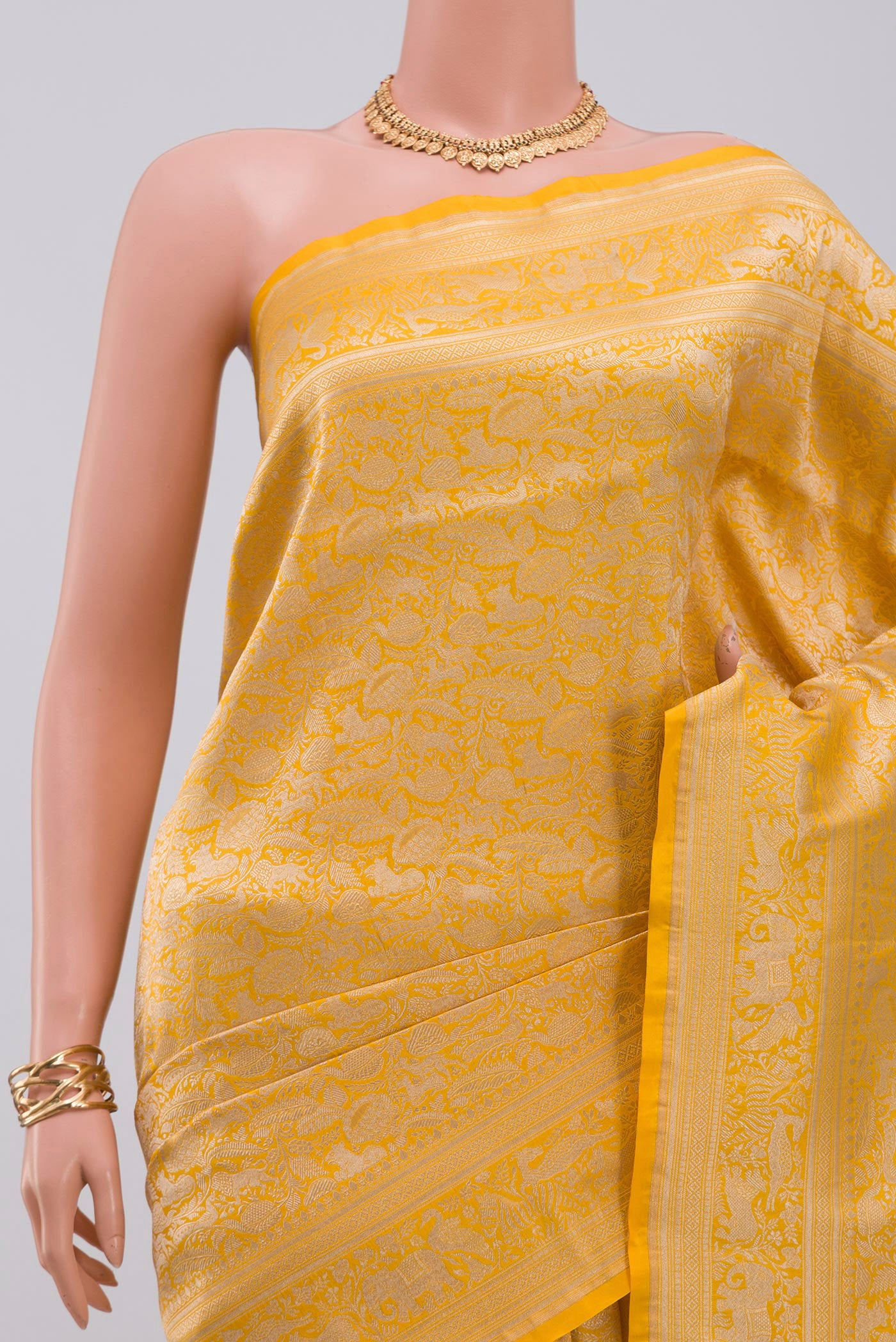 Border image of Yellow Banarasi Saree with Zari Brocade on the body and Fancy Border. 