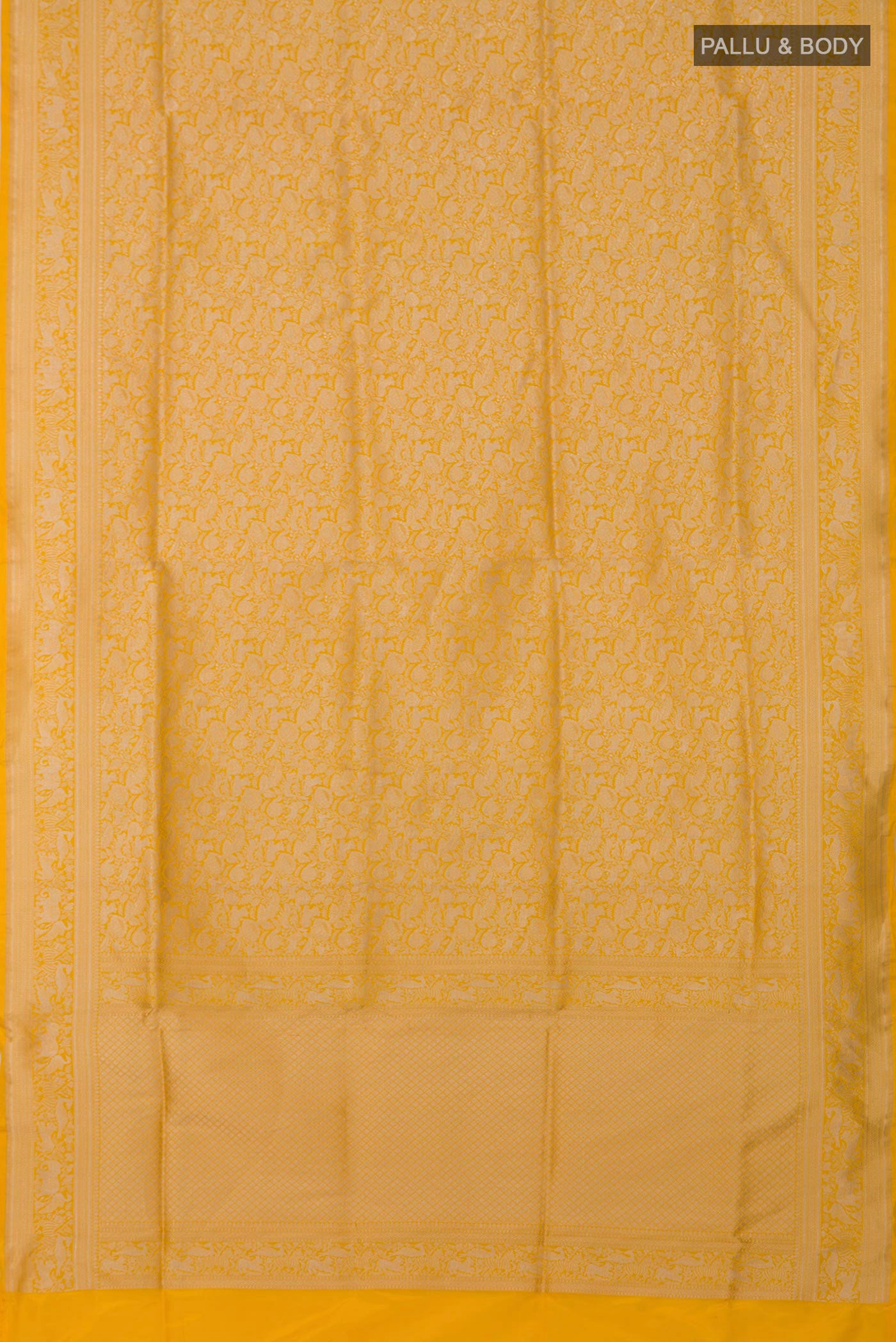Flat view of Yellow Banarasi Saree with Zari Brocade on the body and Fancy Border. 