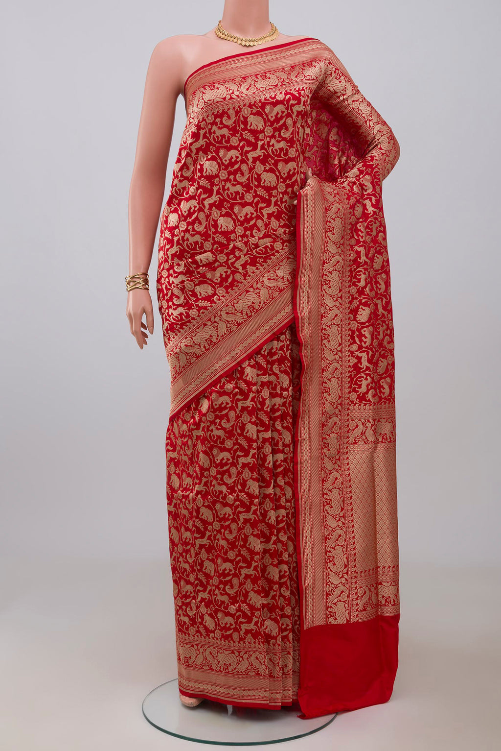Red Banarasi Silk Saree with Zari Brocade on the body and Zari Border.  displayed on a mannequin