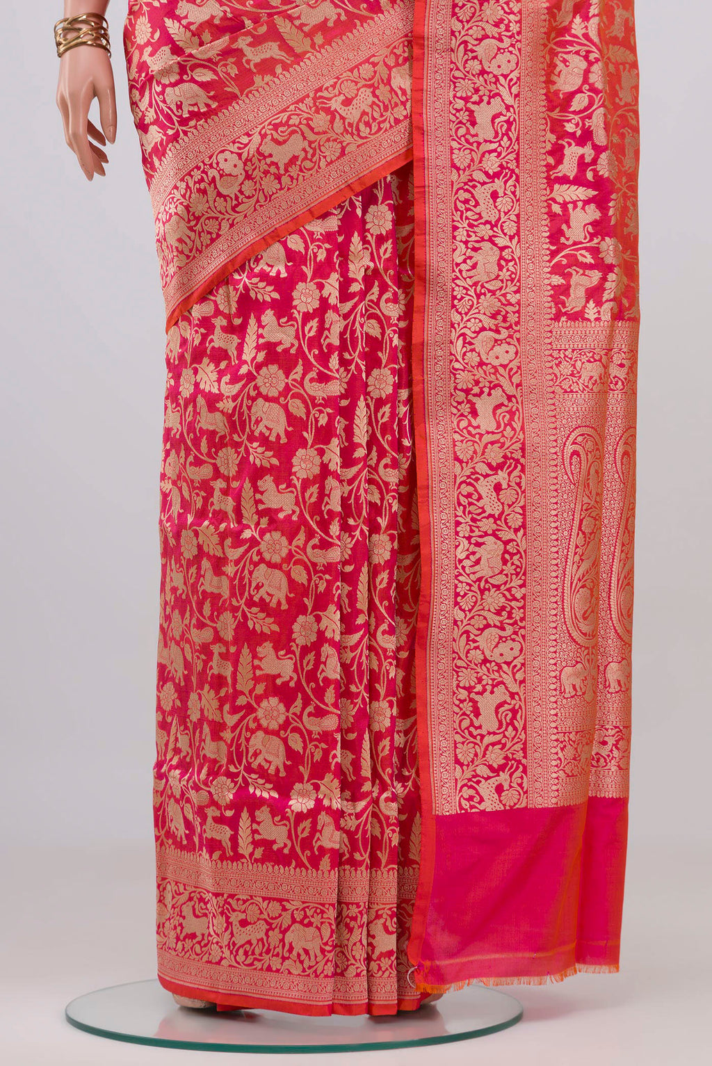Pleats and pallu of Pink with Orange Color Banarasi Silk Saree with Zari Brocade on the body and Fancy Border. 